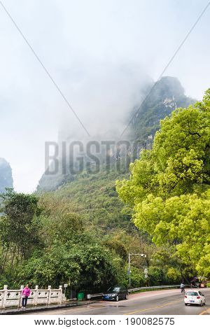 People On Road On Dragon Bridge In Yangshuo