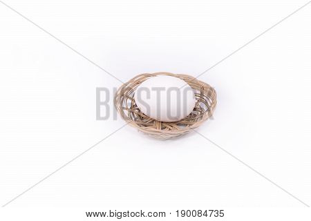 One egg in the basket  with white background