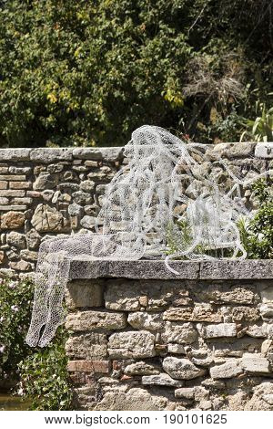 BAGNO VIGNONI, ITALY - JUNE 3 2017: Riflessi sculpture by Daniela Capaccioli in the medieal town of Bagno Vignoni in Tuscany Italy transparent metal wires sculptures