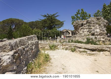 BAGNO VIGNONI, ITALY - JUNE 3 2017: Old mill ruins in the hot springs area of Bagno Vignoni in Tuscany Italy