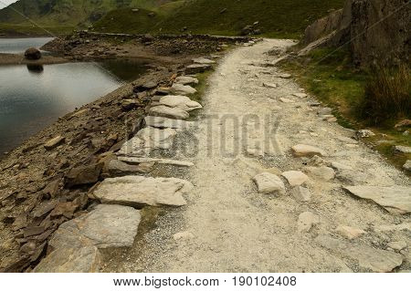 Miners Track Crossing Bridge At Llyn Llydaw On Snowdon.