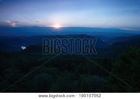 Meander of european river Labe from metal lookout Varhost in spring evening after sunset in czech tourist area named Ceske Stredohori