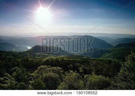 Meander of european river Labe from metal lookout Varhost in spring evening sunset in czech tourist area named Ceske Stredohori