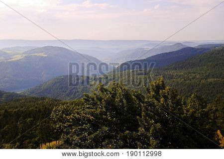 Archive photo from august 2012 with view from metal lookout tower named Varhost to valley of european river Labe in czech republic