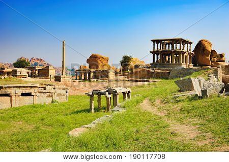 View from Hemakuta hill sunset point with ancient ruins Hampi, Karnataka, India. Landscape with unique mountain formation with amazing stones tropical nature and temple. UNESCO World Heritage Site