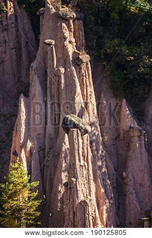Renon's pillars in the Dolomites. The concept of ecological and ethnographic tourism. Journey to  magical fairy-tale country. Magnificent Tyrol