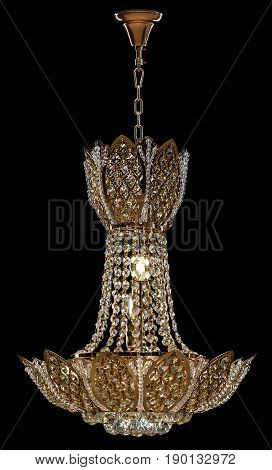 Large crystal chandelier isolated on black background. Luxury royal expensive chandelier for living room, Hall of celebration.