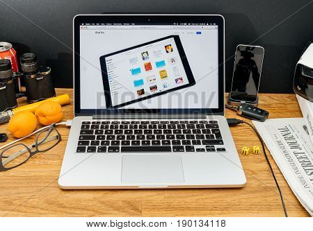 PARIS FRANCE - JUNE 6 2017: Apple Computers website on MacBook Retina in creative environment showcasing latest news from Apple at WWDC 2017 - new Apple File in iOS 11 iPad Pro