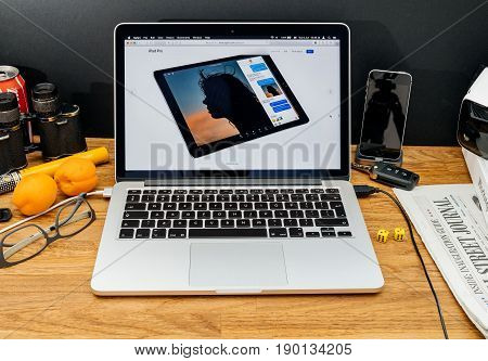 PARIS FRANCE - JUNE 6 2017: Apple Computers website on MacBook Retina in creative environment showcasing latest news from Apple at WWDC 2017 - multitasking in iOS 11 ipad pro