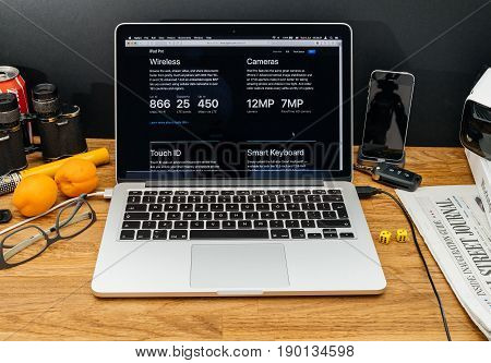 PARIS FRANCE - JUNE 6 2017: Apple Computers website on MacBook Retina in creative environment showcasing latest news from Apple at WWDC 2017 - wireless camera and other specifications are presented