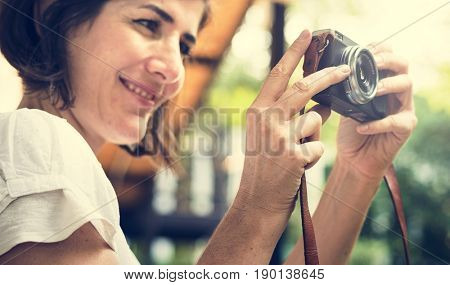 Woman traveler photographer holiday lifestyle trip