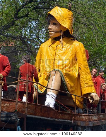 MONTREAL QUEBEC CANADA 19 05 17: The little giant girl walking in the street of Montreal for the 375e anniversary of the city, by Royal De Luxe company Nantes France