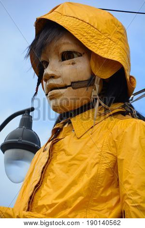 MONTREAL QUEBEC CANADA 19 05 17: The little giant girl walking in the street of Montreal for the 375e anniversary of the city, by Royal De Luxe company Nantes France