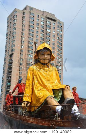 MONTREAL QUEBEC CANADA 19 05 17: The little giant girl walking in the street of Montreal for the 375e anniversary of the city, by Royal De Luxe company Nantes France