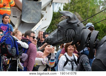 MONTREAL QUEBEC CANADA 19 05 17: Giants Xolo dog walking in the street of Montreal for the 375e anniversary of the city, by Royal De Luxe company Nantes France