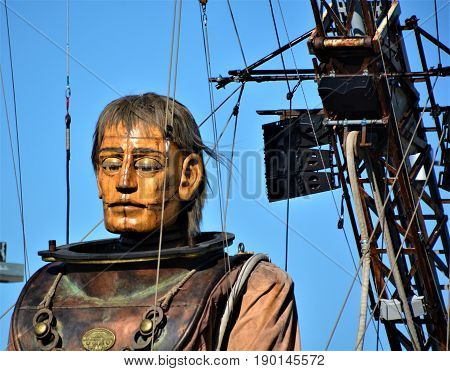 MONTREAL QUEBEC CANADA 19 05 17: The giant deep-sea diver sleeping in the street of Montreal for the 375e anniversary of the city, by Royal De Luxe company Nantes France