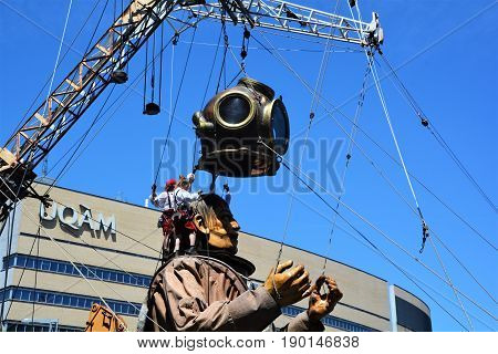 MONTREAL QUEBEC CANADA 19 05 17: The giant deep-sea diver sleeping in the street of Montreal for the 375e anniversary of the city, by Royal De Luxe company Nantes France