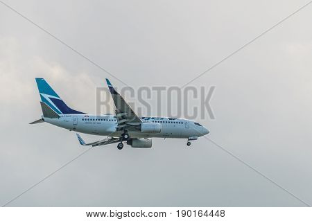 Richmond Canada - June 4, 2017, Jet aircraft in the morning going to YVR Airport