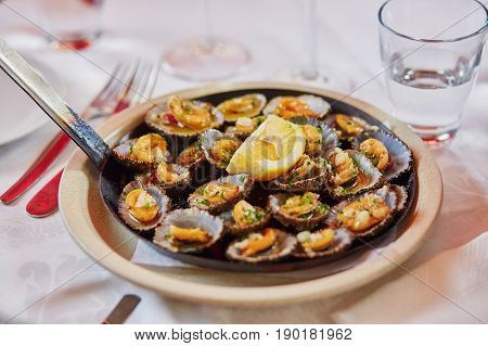 Grilled Limpets Served With Lemon - Traditional Seafood On Madeira Island, Portugal