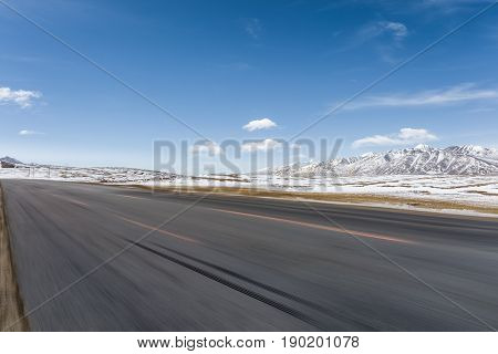 empty road motion blur on snow area plateau tibet