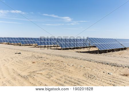 solar panels on the gobi against abundant sunshine sky new energy background