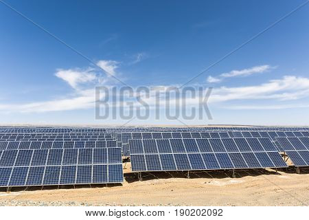 solar panels on the gobi against abundant sunshine sky new energy background