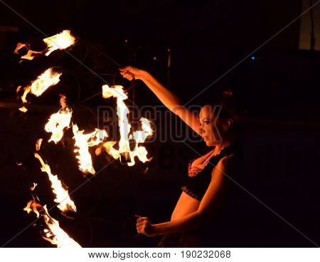 ZAGREB - MAY 2017 : Cest is d'Best famous street festival with many performers on May 2017 in Zagreb. Yanika fire performer doing her dance with fire