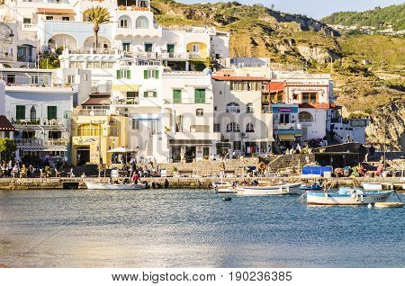 Ischia, Italy - April, 2017: tourist harbor with typical Mediterranean boats in the Sant'angelo on Ischia Island, tourist destination in the Gulf of Naples, Italy