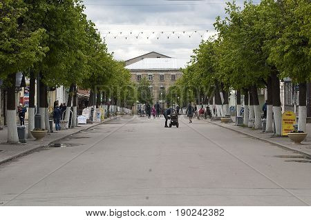 Gatchina Leningrad region Russia - June 03 2017: Townspeople and tourists walk along Cathedral street