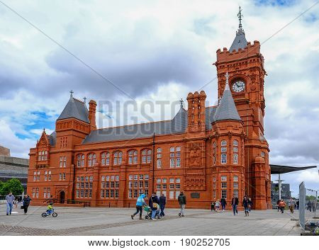 Cardiff Bay Cardiff Wales - May 20 2017: Pierhead builiding with people walking around the square.