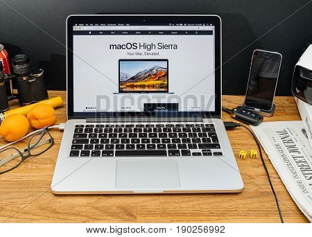 PARIS FRANCE - JUNE 6 2017: Apple Computers website on MacBook Retina in creative environment showcasing latest macOS High Sierra from Apple at WWDC 2017 - presentation of the new operating system