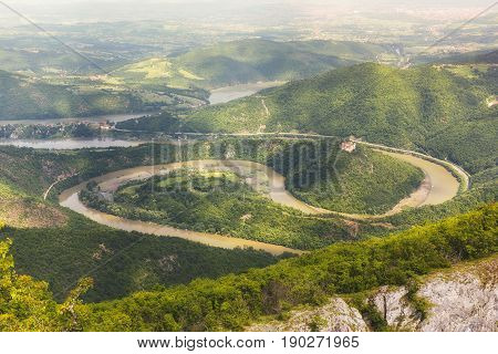 Ovcar Kablar Gorge, Serbia.   Meanders of  West Morava river,  view from the top of the Kablar mountain. Dramatic morning lights and shadows in springtime