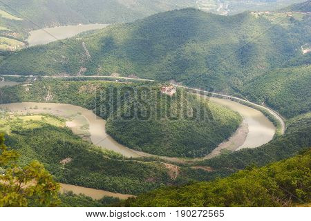 Meanders of West Morava river. Gorge between mountains Ovcar and Kablar, Western Serbia. Dramatic morning lights and shadows in springtime