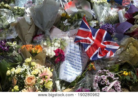 LONDON, UK - JUNE 7, 2017:  Floral tributes laid at the site of the London terrorist attack at London Bridge on the 3rd of june 2017.