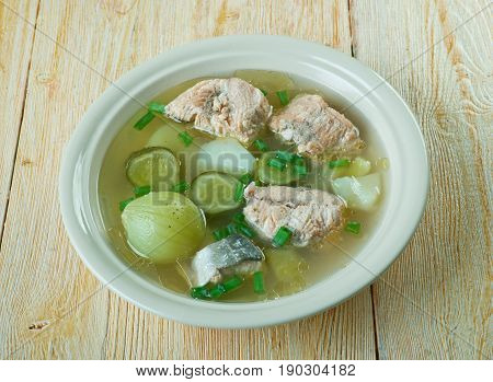 Russian fish solyanka soup with salmon. close up