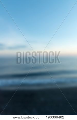 Amed Black Sand Beach Bali Indonesia Travel theme creative abstract blur background with bokeh effect