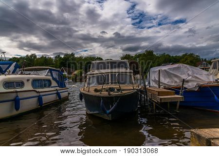 Boats Anchored On The Bank Of The River, Residential Houses On The Other Side, Beautiful Broad River