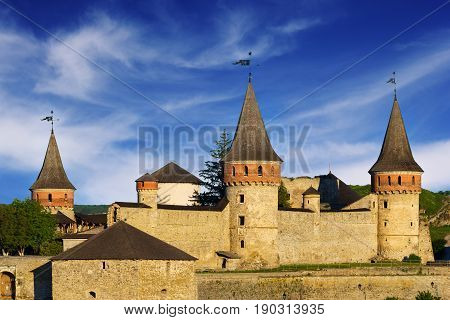 Castle in Kamyanets-Podilsky over beauiful dramatic blue sky Ukraine
