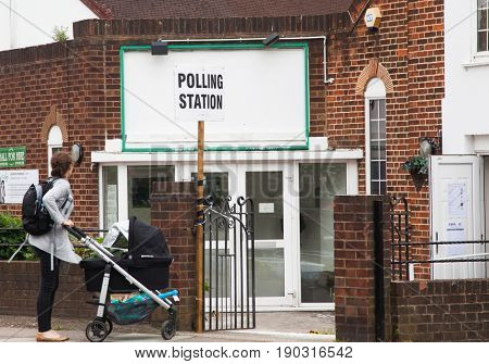 LONDON, UNITED KINGDOM - JUNE 8, 2017: Unidentified citizens going to vote at a polling station during the British general elections in South London, United Kingdom on June 8, 2017.