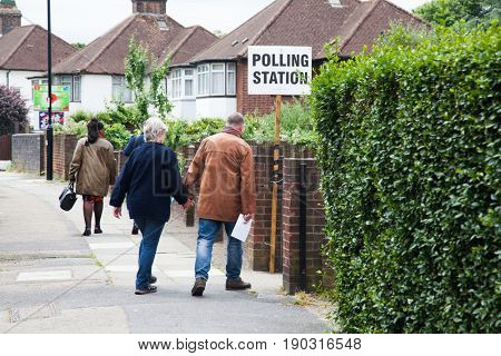 LONDON, UNITED KINGDOM - JUNE 8, 2017: Unidentified citizens going to vote at a polling station during the British general elections in South London, United Kingdom on June 8, 2017.