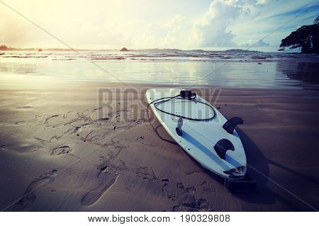 closeup of surfboard on beach ready for next surf