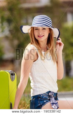 Attractive Woman Tourist With Suitcase Relaxing After Trip