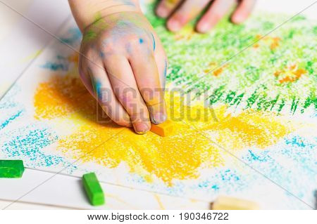 Baby draws the crayons.Selective focus. Children's Creativity. Early child development