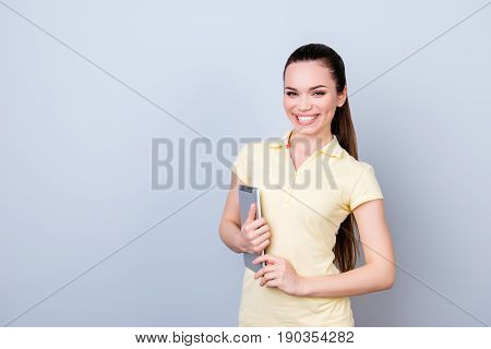 Uccess, Education And Work Concept. Young Cute Brunette With Beaming Smile Is Standing With A Tablet