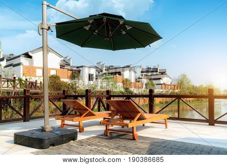 Leisure chairs and lake Huizhou ancient buildings