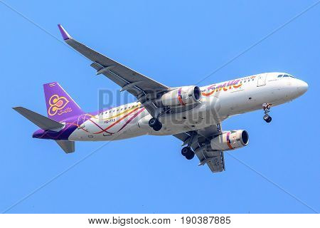Bangkok, Thailand. - April 23, 2017 : Plane of Thai Airways in the sky landing to Suvanabhumi airport.