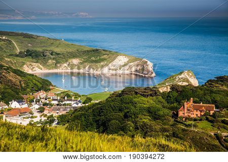 british seaside - summer holiday destination - Lulworth cove on Jurassic coast in southern Devon, UK