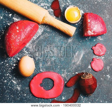 Pink doudh and food ingredients: egg beet flour. Top view flat lay