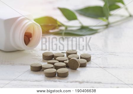 pill herbal on top view of wood table and copy space