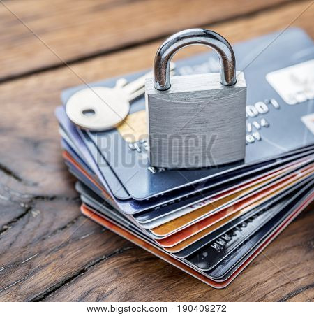 Credit cards and simle mechanical lock. Security concept.